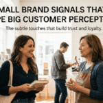 A customer smiles while speaking with an employee in a bookstore, illustrating how subtle touches can build brand trust and loyalty.